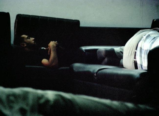 A person is lying on a couch.
